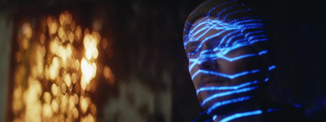 Lights project on the mans face