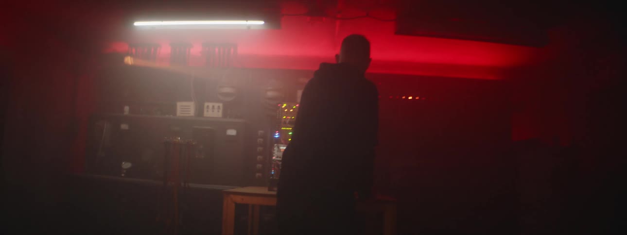 A man is pulling plugs from a switchboard