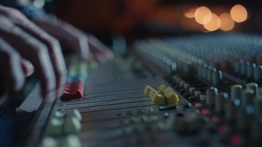 A person using switches in order to make music