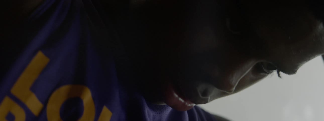A boy is looking down