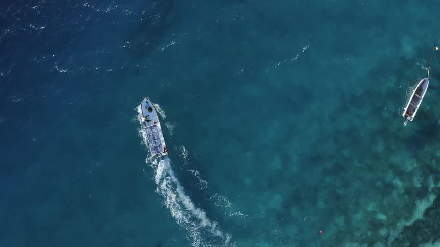 The view is of the ocean and you can see a boat