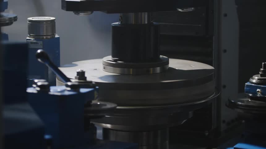 Top and bottom pieces meet and then rotate together on machine