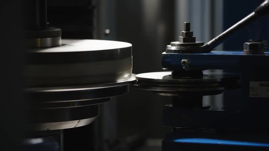 A machine grinder spinning wheels around