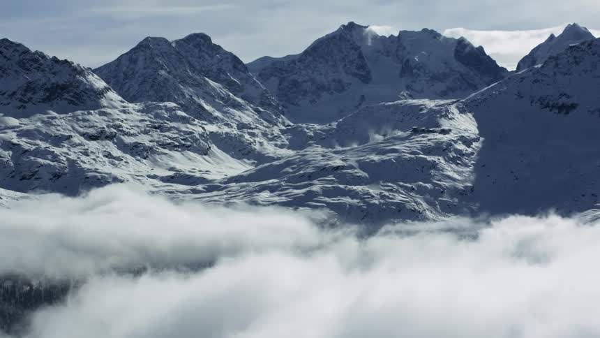 Aerial View: Snowy St. Moritz Mountain Range with Clouds
