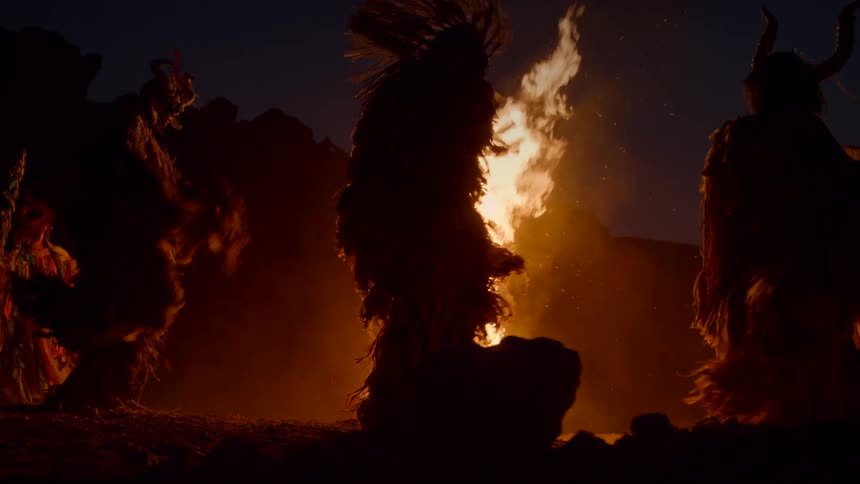 Natives are dancing around the campfire