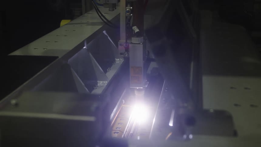 An up close of a large machine with a light in the middle of it
