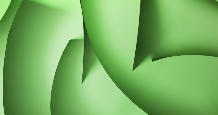 Green lines on paper casting shadows on the green surface