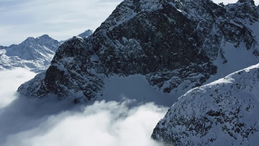 Snowy Peaks: Aerial Splendor of Mountainous Landscapes