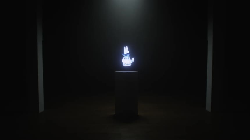 Close up of digital graphics spinning on a screen inside a dimly lit room