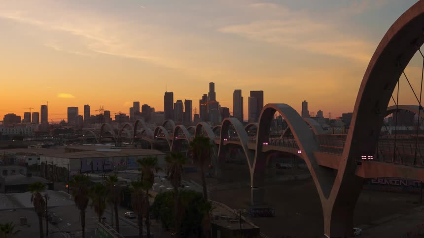 Sixth street viaduct bridge and skyscrapers at dusk
