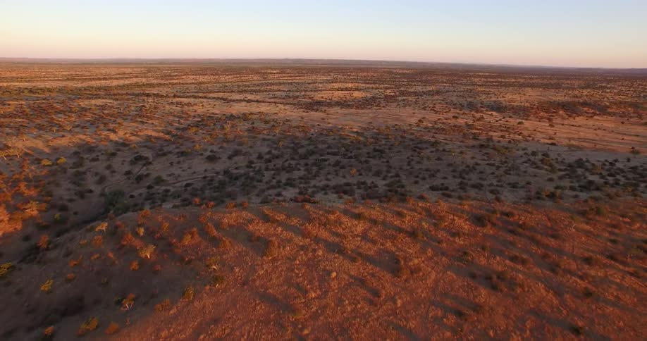 The sun is setting over this desert