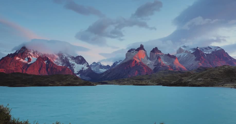 The clouds flow over the mountains