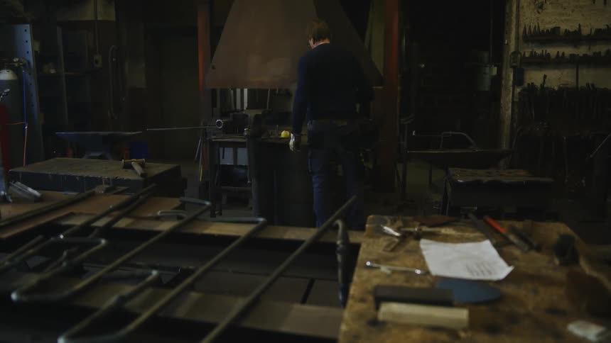 The view is of a man inside of his house in the day time