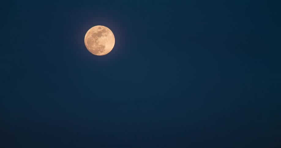 The full moon rises