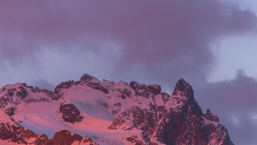 The clouds cover the moon over the mountain