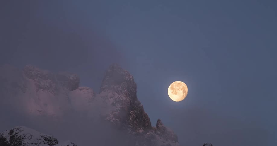 A view of the moon setting