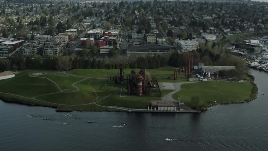 Aerial view of the shoreline next to a large city