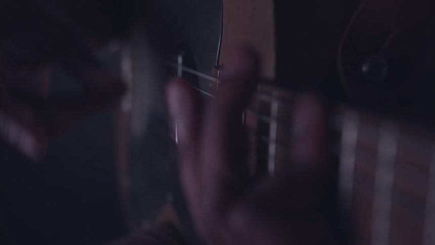A man plays guitar
