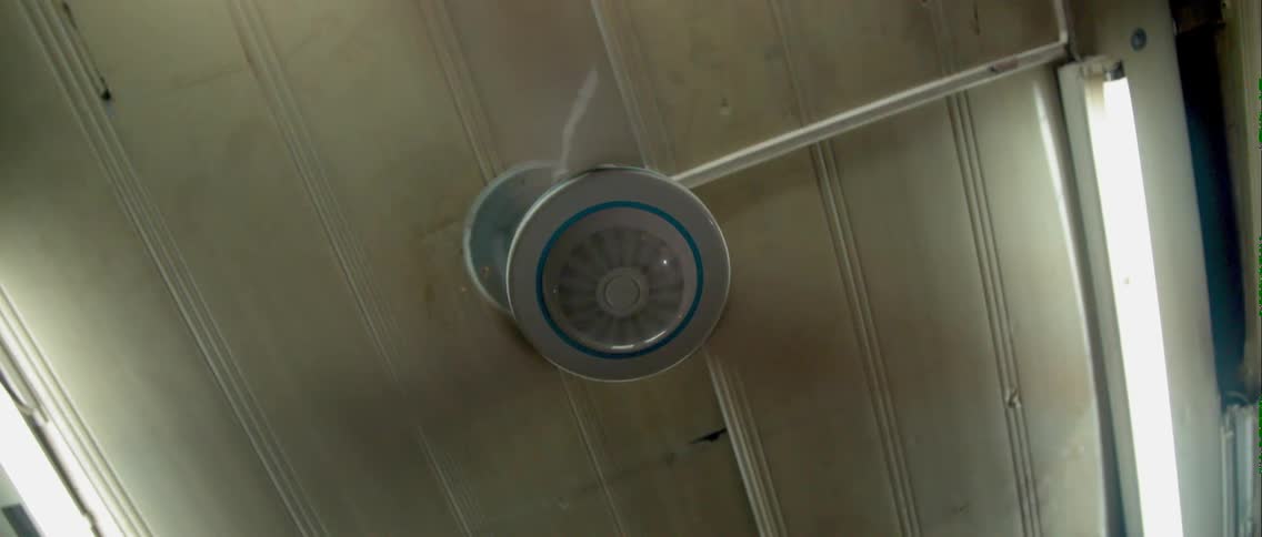 A ceiling fan starts to spin