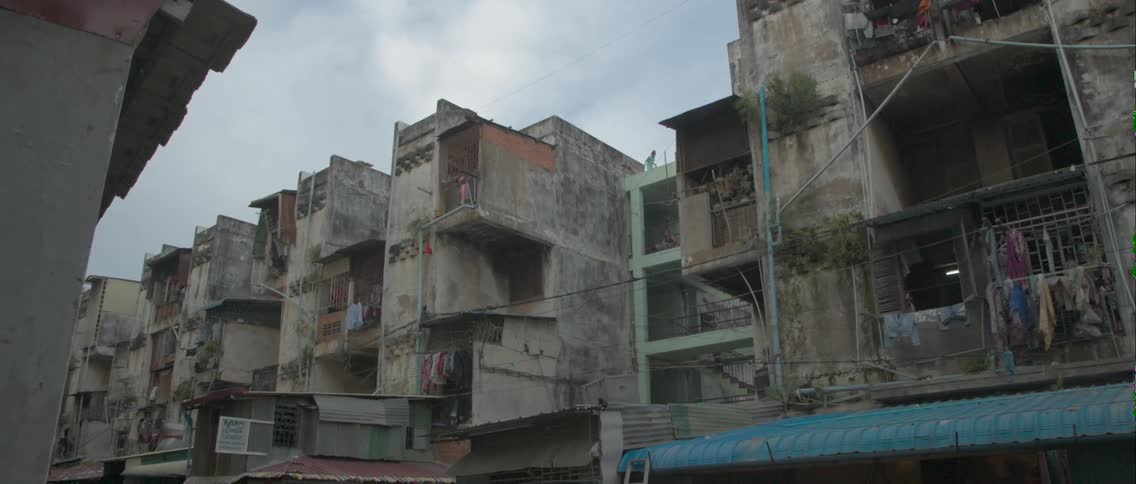 A row of buildings are in disrepair