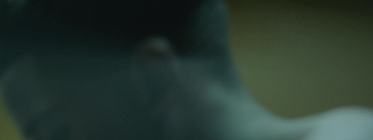 A young man spits blood