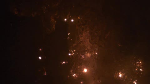 Lights flicker in a water like substance sparking new lights and bubbles