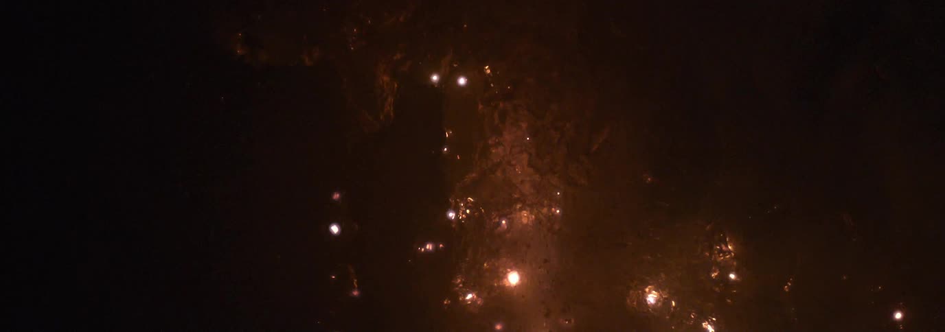 Lights flicker in a water like substance sparking new lights and bubbles