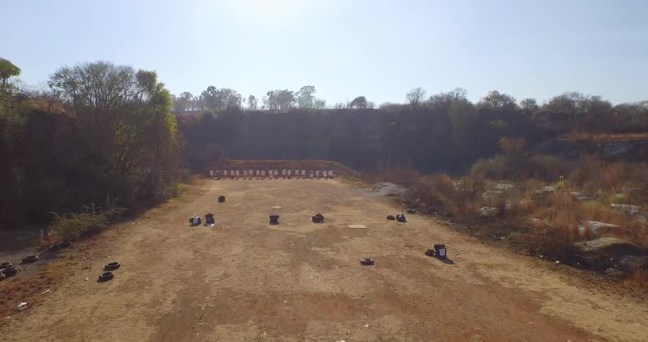 A field lined with tires on a sunny day