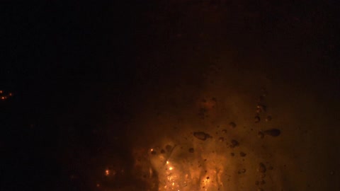 An extreme close up of bubbles and exploding light sources