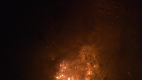 Surface of bubbling liquid brightens and darkens from within