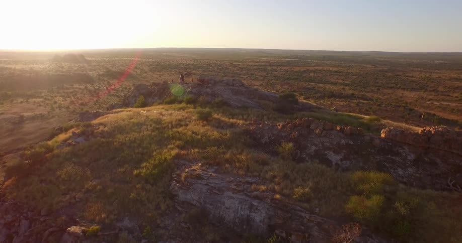 The sun rises over a large plain