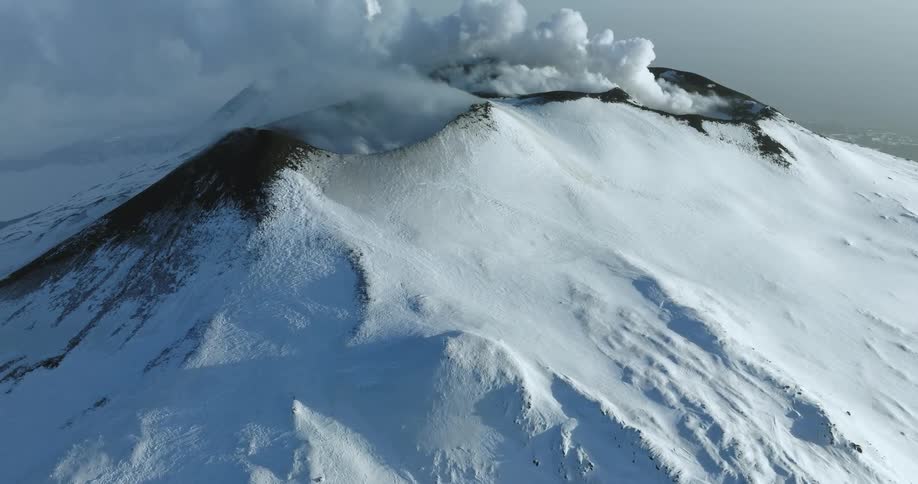 Snow covers the peaks of a mountain range
