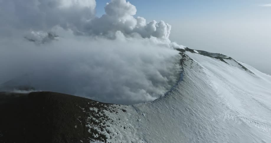 Aerial view of a volcano erupting during winter season