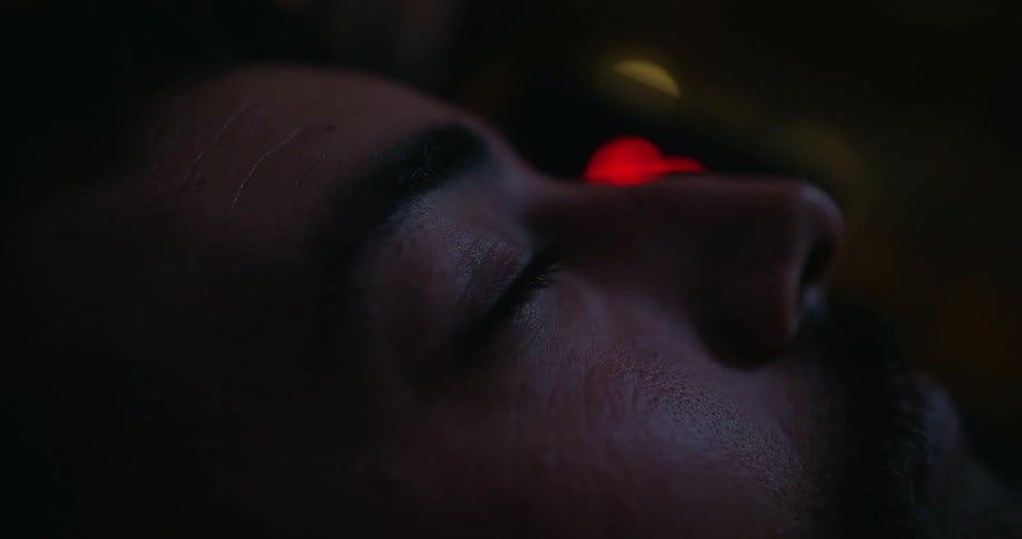 Man with beard opens his eyes