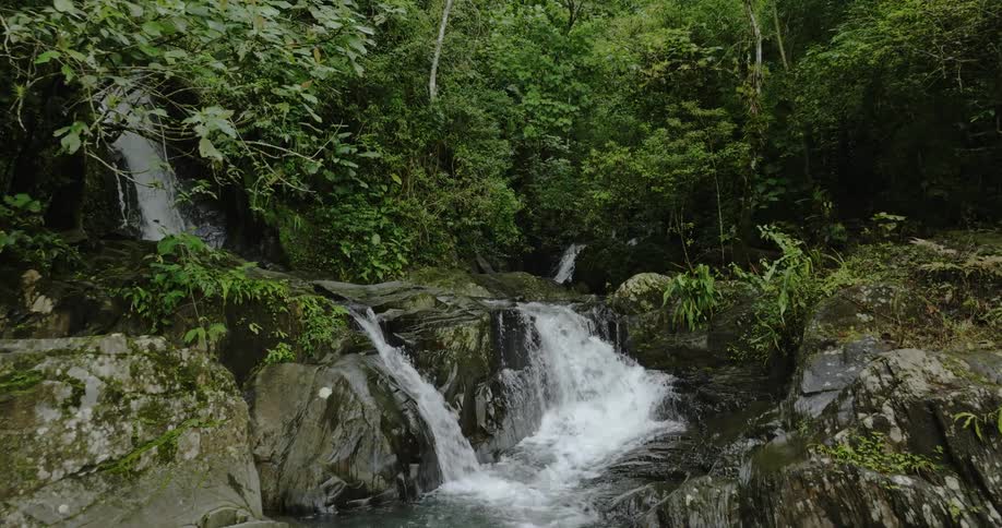 A waterfall during the spring time is displayed