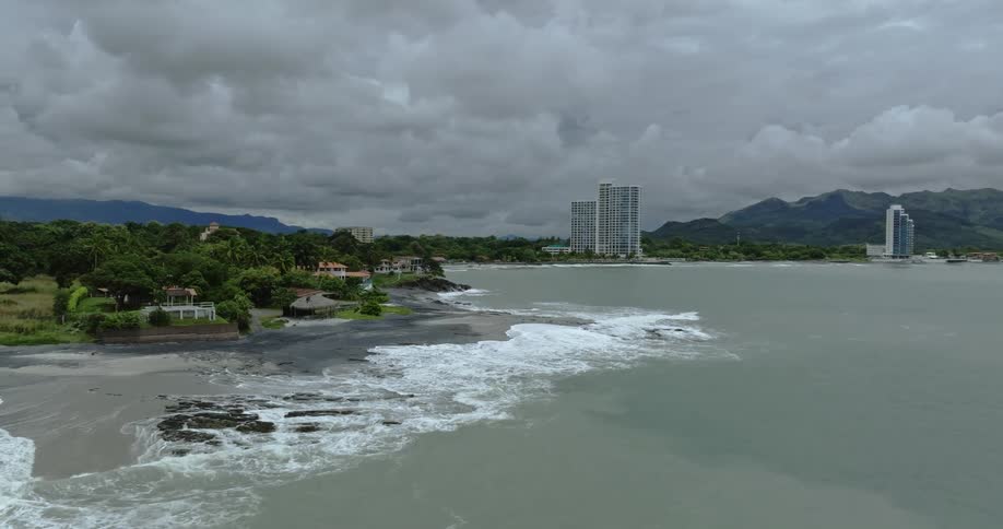 A lake near a city is displayed on a cloudy day