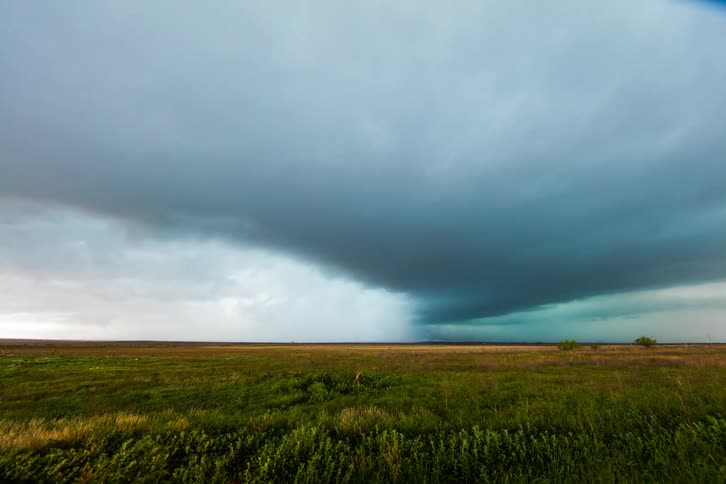 Clouds billowing over field time lapse