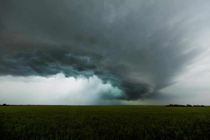 Storm clouds form over a field