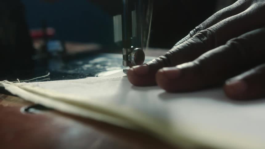 Woman uses sewing machine
