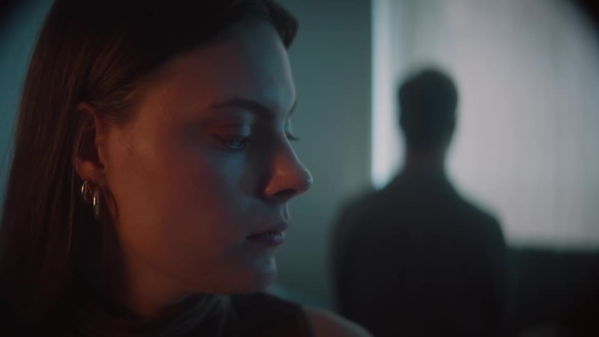 The view is of a woman that is looking at the camera