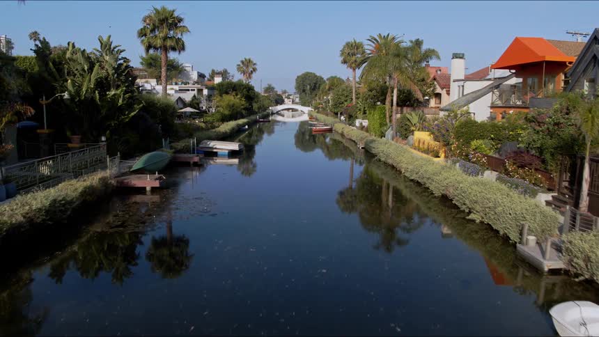 A panoramic view of a tropical american suburb along a boating waterway