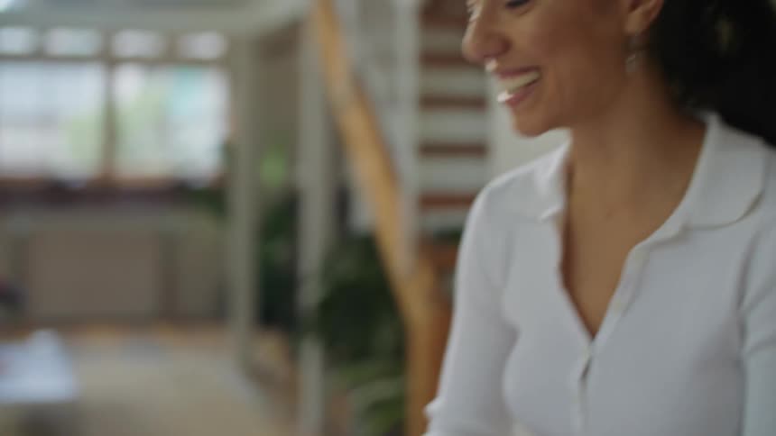 Woman and man are talking to someone on a laptop