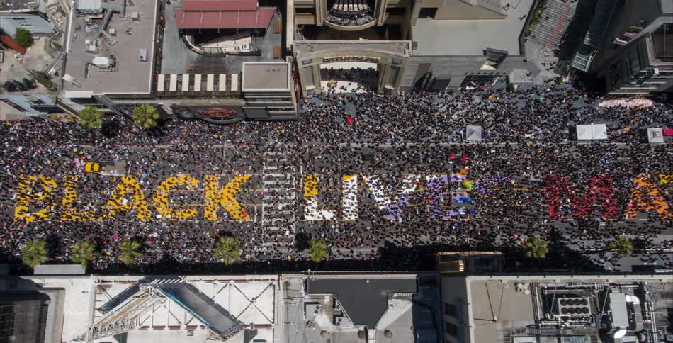 An aerial shot of a crowded city street during an event