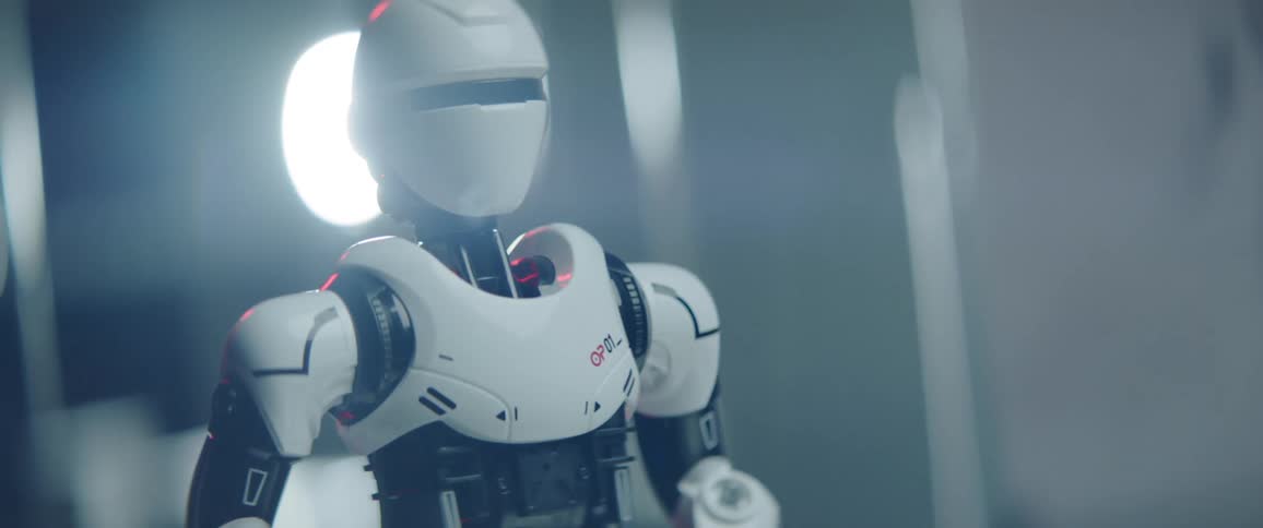 A toy robot with a blinking visor slowing turning around