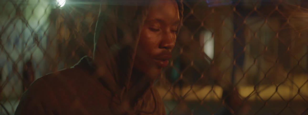 A man in a hoodie shakes his head