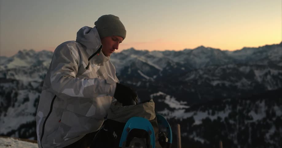 A man is hiking outdoors through the mountains