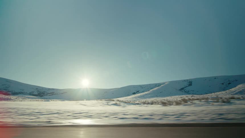 A rural landscape is displayed in winter