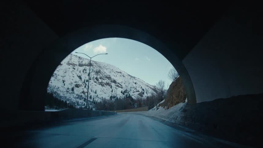 Vehicle drives through tunnel