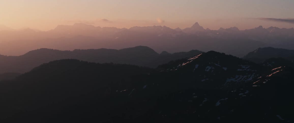 A wide shot of mountains in the morning