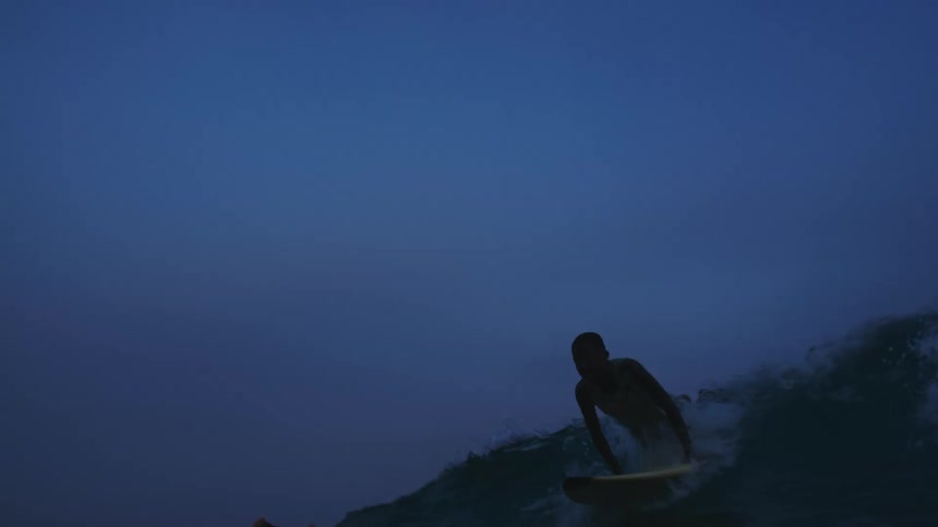 Two surfers preparing to ride before the camera gets submerged